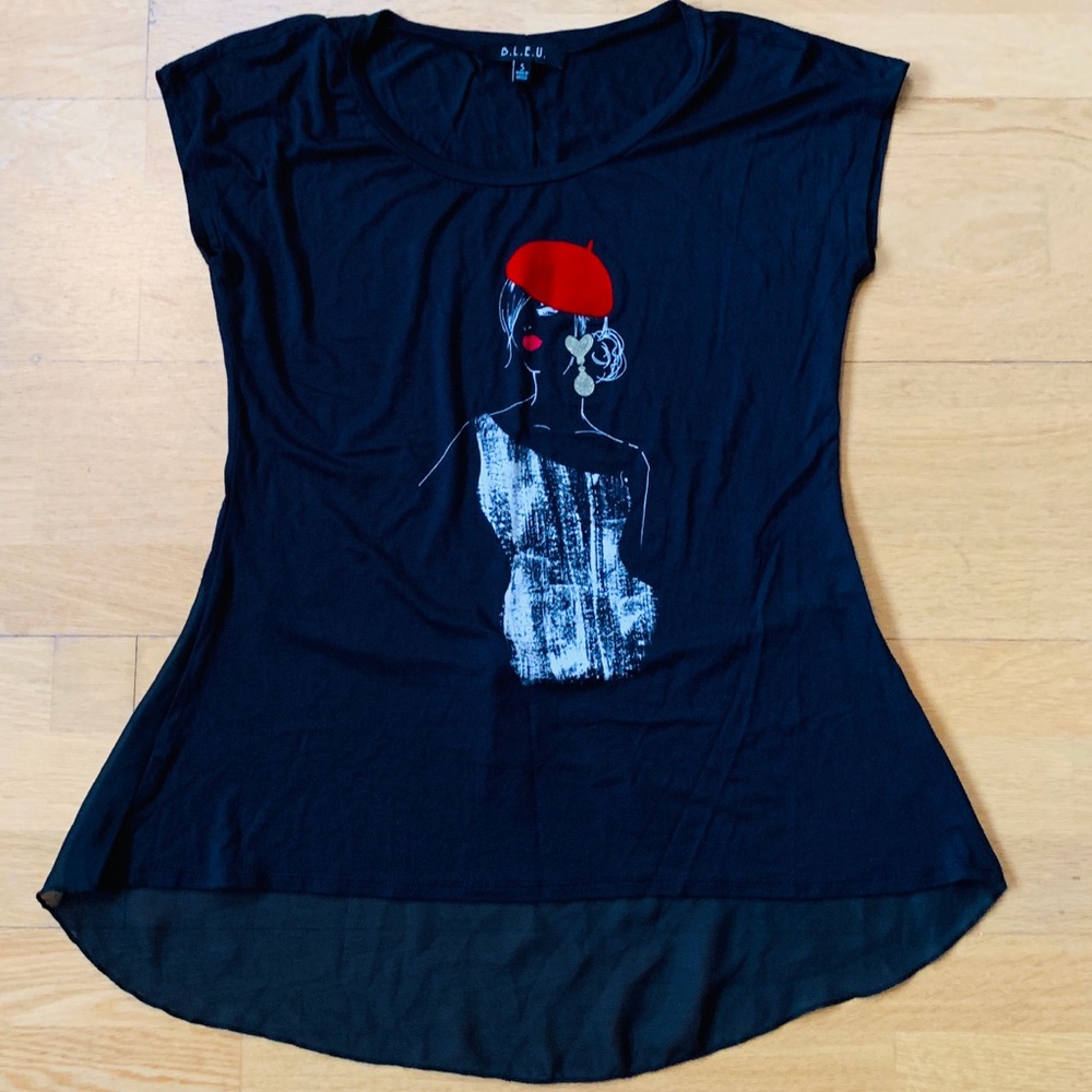 Black t shirt with girl in red hat.